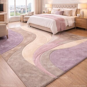 This image features a cozy bedroom styled with a hand tufted abstract rug beside the bed, offering a soft wool surface in soothing pastel tones.