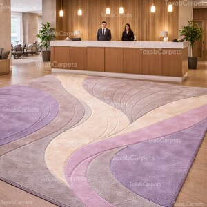 A contemporary home office featuring a wavy wool area rug for a calm working environment.