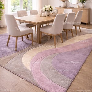 This image displays a dining room styled with a hand tufted abstract rug under the table, adding subtle color and texture.
