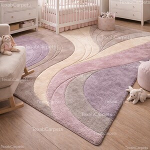 This image shows a kids room styled with a soft hand tufted abstract rug in gentle lavender and beige shades.