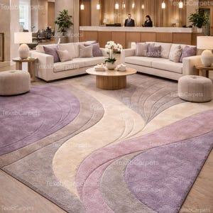 This image displays a boutique hotel interior with a hand tufted abstract rug, highlighting luxury wool texture.