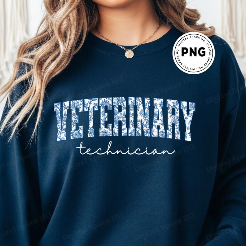 May include: Navy blue sweatshirt with the words "VETERINARY" in large white block letters filled with a blue floral pattern. Below, in a smaller, cursive font, it reads "technician". A round PNG logo is in the upper right corner.