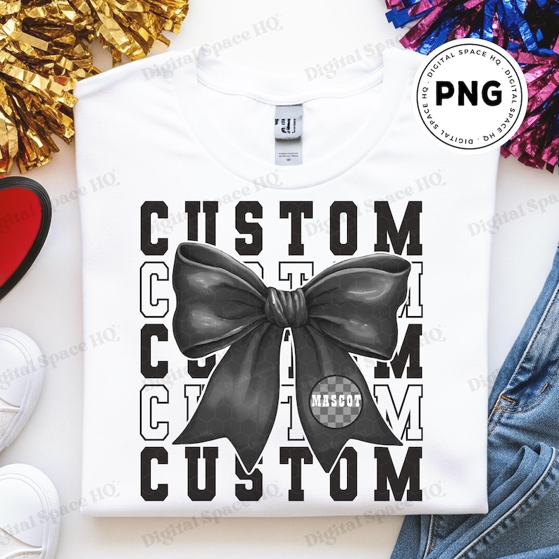 May include: White crew neck t-shirt with a large black bow graphic and the word "CUSTOM" repeated. The bow has a checkered circle with the word "MASCOT".
