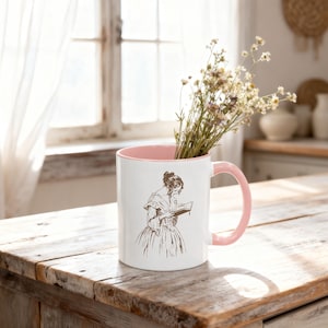 Pink accent coffee mug mockup styled on a rustic farmhouse kitchen counter with soft spring sunlight and wildflowers inside, Mother’s Day and Easter themed product photo.