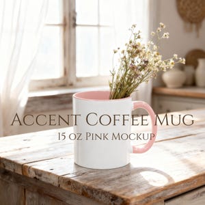 Pink accent coffee mug mockup styled on a rustic farmhouse kitchen counter with soft spring sunlight and wildflowers inside, Mother’s Day and Easter themed product photo.