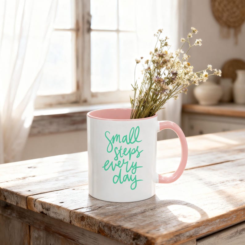 Pink accent coffee mug mockup styled on a rustic farmhouse kitchen counter with soft spring sunlight and wildflowers inside, Mother’s Day and Easter themed product photo.