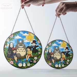 May include: Two round stained glass panels featuring a colorful scene with cartoon characters, a large gray creature, and a yellow sun. The panels are held by chains and have a black border. The background is a blue sky with white clouds.