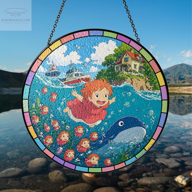 May include: Round stained glass window featuring a vibrant illustration of a young girl in a red dress, a whale, boats, and a house by the sea. The window has a colorful border and is suspended by a chain.
