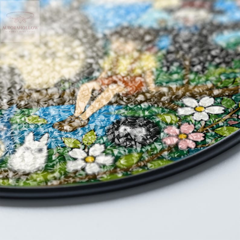 May include: A mosaic art piece featuring a whimsical scene with a figure, flowers, and a white rabbit. The artwork incorporates shades of blue, green, white, and pink, with a black border. The logo "AURORAHOLLOW" is in the upper left corner.