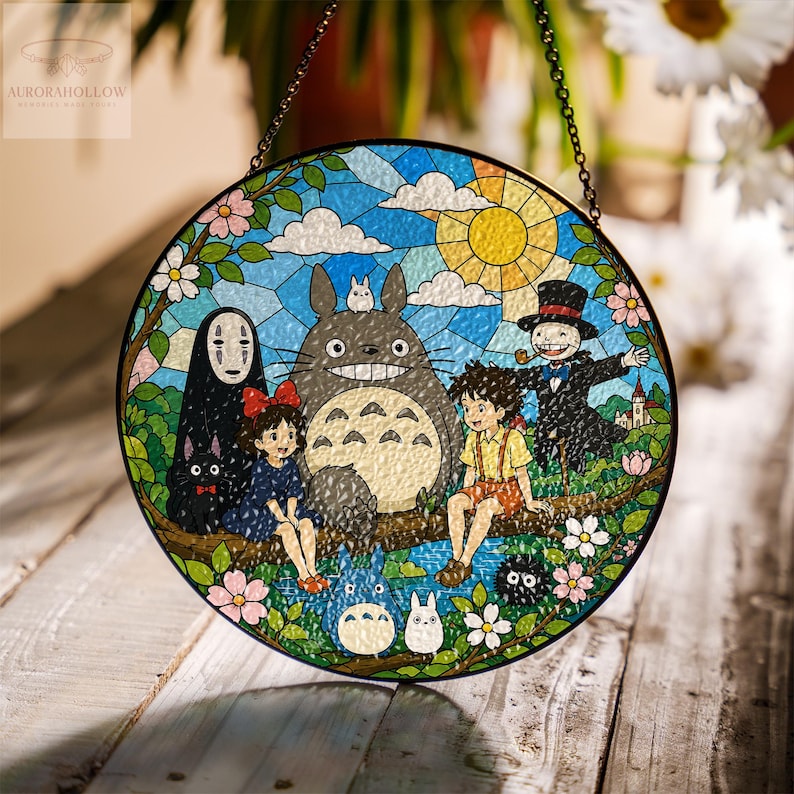May include: Round stained glass panel featuring characters from a popular animated film. The artwork depicts a sunny sky, characters, and floral elements. The panel is framed with a black border and includes a hanging chain.
