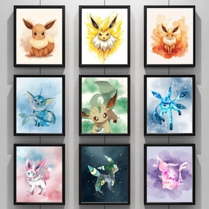 Peut inclure: Neuf impressions encadrées à l'aquarelle représentant différents personnages Pokémon. L'œuvre présente Eevee, Jolteon, Flareon, Vaporeon, Leafeon, Glaceon, Umbreon, Sylveon et Espeon, chacun sur un fond abstrait coloré.