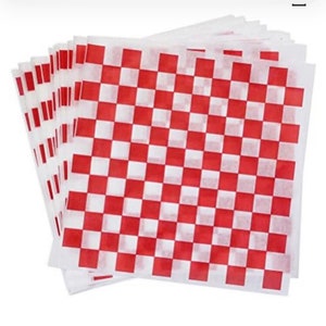 May include: A stack of red and white checkered paper squares. The paper is thin and has a slightly crinkled texture.