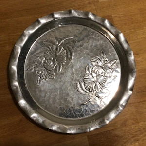 Vintage handwrought hammered aluminum tray with embossed floral design