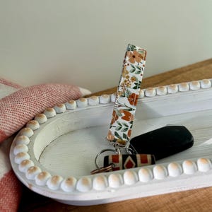 Porte-clés au poignet avec porte-clés floral pastel