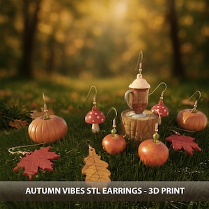 May include: A collection of autumn-themed earrings, including pumpkins, apples, mushrooms, and maple leaves. The earrings are 3D printed and displayed on a bed of green grass. The text "AUTUMN VIBES STL EARRINGS - 3D PRINT" is visible.