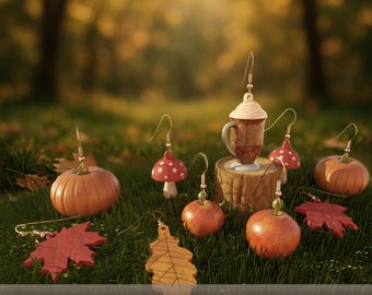 May include: A collection of autumn-themed earrings featuring miniature 3D printed pumpkins, red and white spotted mushrooms, red apples, maple leaves, oak leaves, and a coffee mug with whipped cream. The text reads AUTUMN VIBES STL EARRINGS - 3D PRINT.