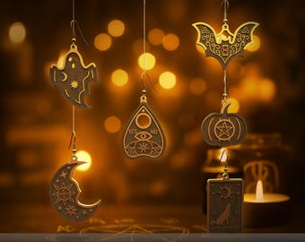 May include: Six mystic Halloween earrings in various shapes, including a ghost, bat, pumpkin, crescent moon, Ouija board planchette, and tarot card. The earrings are gold-colored and designed for 3D printing. The text "YES NO" is visible on one earring.