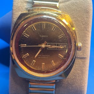 Vintage 1970s Timex Automatic Watch: Gold Tone Cushion Case, Speidel Band
