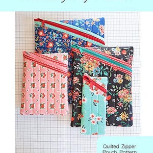 May include: Four quilted zipper pouches in various floral patterns, with red, teal, and blue zippers. The pouches are in different sizes. The text "Hemingway Pouch" is at the top of the image.