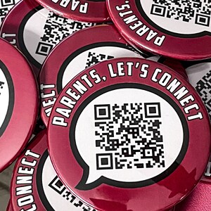 May include: A stack of red round buttons with a black border and white text that reads "Parents, Let's Connect". Each button has a black and white QR code in the center.