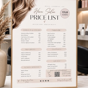 May include: A rectangular hair salon price list sign in a gold frame. The sign features a beige background with brown text, a hair graphic, and a QR code. It lists services including haircuts, styling, custom color, treatments, and extensions.