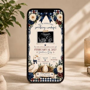 May include: A smartphone displaying a pregnancy announcement graphic featuring a navy blue bow, floral accents, and a sonogram image. The text reads We're expecting something wonderful, February 14, 2027, Valentine's Day, and Baby Smith is on the way.