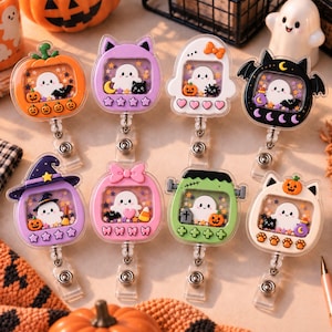 May include: Eight Halloween-themed badge reels featuring clear shaker cases filled with loose glitter and small charms. Each reel displays a ghost character inside, surrounded by various festive icons like pumpkins, bats, cats, and candy corn, attached to a retractable cord and metal clip.