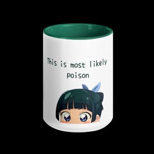 May include: White ceramic mug with a green interior and a black handle. The mug features the text "This is most likely poison" above an anime-style illustration of a character with blue eyes and dark hair.