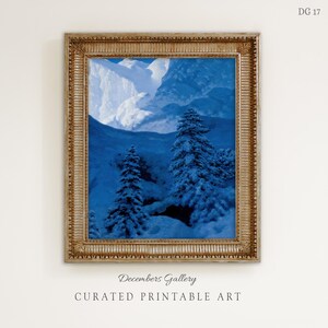 May include: A framed print featuring a winter landscape with snow-covered trees and mountains in shades of blue and white. The artwork is in a gold ornate frame. The text "Decembers Gallery" and "CURATED PRINTABLE ART" are at the bottom.