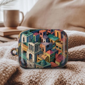 May include: A colorful, patterned AirPod case featuring a detailed illustration of a cityscape with various buildings in shades of blue, green, yellow, and red. The case is resting on a soft, textured surface.