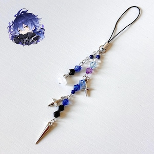 May include: A phone charm featuring a dangling arrangement of blue, black, purple, and clear beads, silver star-shaped charms, and a silver spike pendant. An illustration of an anime character with blue hair is positioned in the upper left corner.
