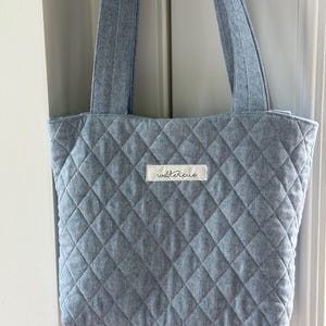 Custom Memory Tote made from your loved ones clothes.  This tote of bag will always hold a special place in your heart.  Made by watercue.