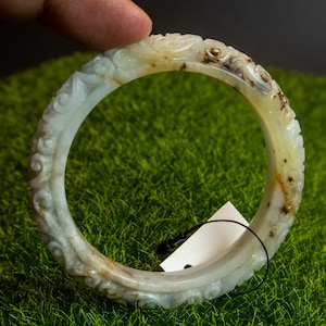 52MM Natural Burmese Jadeite Bangle–Grade A Untreated Jade with Lucky Flower Carving, Golden Yellow Accents & Rare “Moss in Snow” Inclusions
