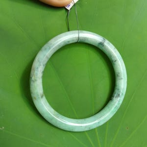 58MM Authentic Grade A Burmese Jadeite Bangle– Translucent Light Green with “Moss in Snow” Pattern | Handcrafted Amulet Harmony & Prosperity