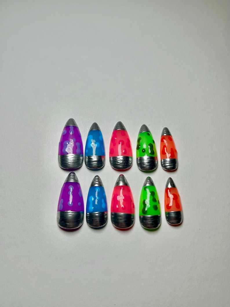 May include: Ten lava lamp-style nail art designs. Each nail features a silver base and a translucent, teardrop-shaped top in colours like purple, blue, red, green, and orange. The designs are arranged in two rows of five.