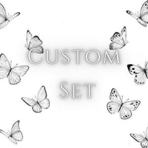 May include: A white background with several grayscale butterfly illustrations. The words "CUSTOM SET" are displayed in a stylized font. The butterflies are in various positions, some with detailed wing patterns.