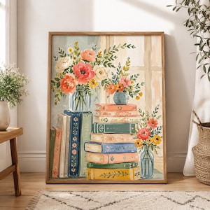May include: A framed painting depicting a stack of colorful books with floral arrangements in glass vases. The books are arranged in vertical and horizontal piles, featuring shades of blue, green, yellow, and pink, adorned with various flowers.