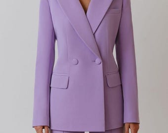 May include: A lavender double-breasted suit, featuring a tailored blazer with two rows of buttons and a notched lapel, paired with matching trousers. The suit has two front pockets and is from Muskan Suit Studio.