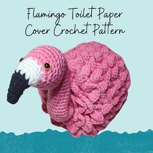 May include: Pink crocheted flamingo toilet paper cover. The flamingo is crocheted in a textured pattern and has a white beak and black eyes.