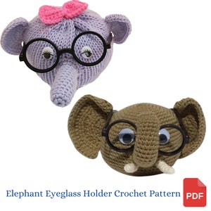May include: Two crocheted elephant eyeglass holders. One is purple with a pink bow and the other is brown. Both have black glasses and googly eyes.