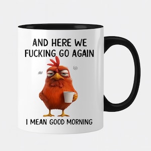 May include: White ceramic mug with a black handle and rim. The mug features a grumpy cartoon chicken holding a coffee cup, with the text "AND HERE WE FUCKING GO AGAIN I MEAN GOOD MORNING" in black font.