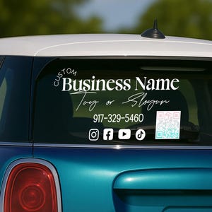 May include: White custom business name decal on a teal car window. The decal includes the text "Custom Business Name Tag or Slogan", a phone number, social media icons, and a QR code.