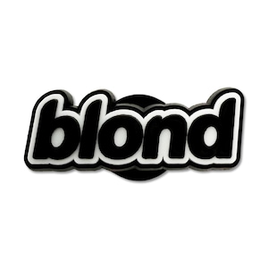 Könnte beinhalten: Ein schwarz-weißes Accessoire mit dem Wort "blond" in einer fetten, abgerundeten Schriftart. Das Wort ist weiß mit schwarzer Umrandung, auf einem schwarzen Grund. Das Design ist schlicht und modern.
