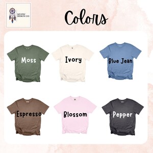May include: Image showcasing six short-sleeved t-shirts in various colors: moss green, ivory, blue jean, espresso brown, blossom pink, and pepper gray. Each shirt displays its color name in bold text. The top left corner features a logo with a dreamcatcher.