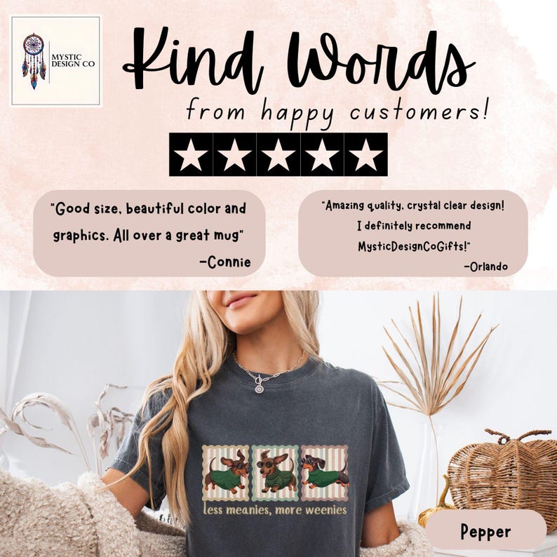 May include: A dark gray t-shirt with a graphic of three dachshunds wearing green sweaters. The text "less meanies, more weenies" is below the graphic. The image also includes customer reviews and the Mystic Design Co logo.