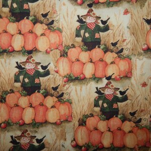 May include: A repeating pattern featuring scarecrows, pumpkins, and black birds. The scarecrows wear green jackets and hats, standing amidst orange pumpkins and wheat stalks. Red apples and autumn leaves are scattered throughout the design.