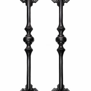 May include: Two vertical black metal door handles with a smooth, elongated cylindrical body featuring a central rounded bulbous detail. Each handle terminates at both ends with a decorative four-pointed diamond-shaped mounting plate with screw holes.