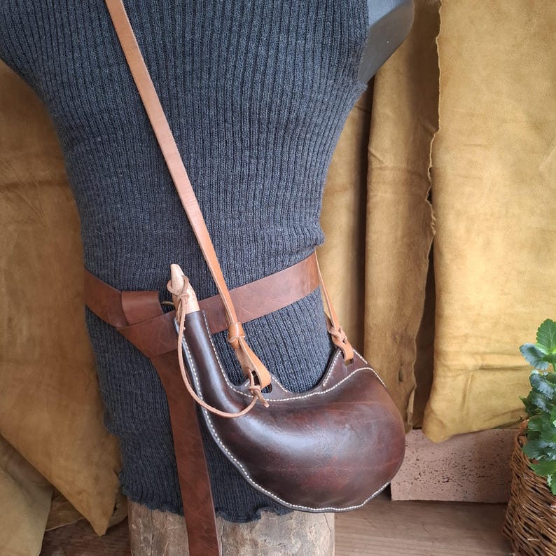 Handmade Viking leather canteen made from vegetable tanned leather and treated with natural beeswax, suitable for reenactment and outdoor use.