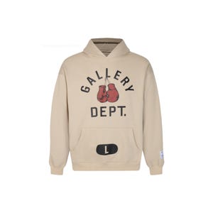 May include: A beige hoodie with a front pocket and a hood. The front of the hoodie features the text "GALLERY DEPT." above a graphic of red boxing gloves. A black "L" is on the front pocket. The hoodie has a relaxed fit.