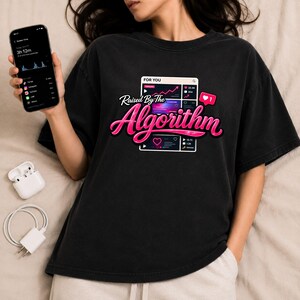 Lifestyle mockup featuring Raised By The Algorithm shirt design with smartphone and internet culture aesthetic.